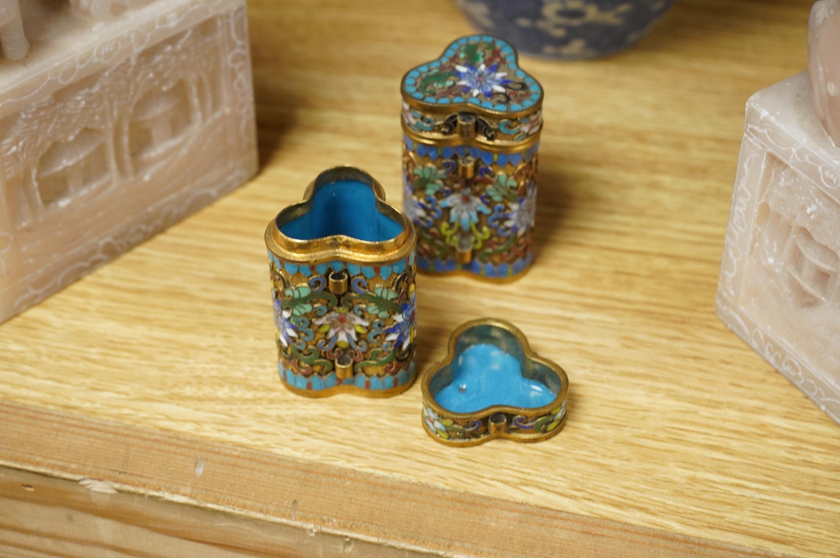 A pair of Chinese soapstone lion-dogs - 22.5cm high, two cloisonné enamel boxes and covers and a blue & white jar & cover